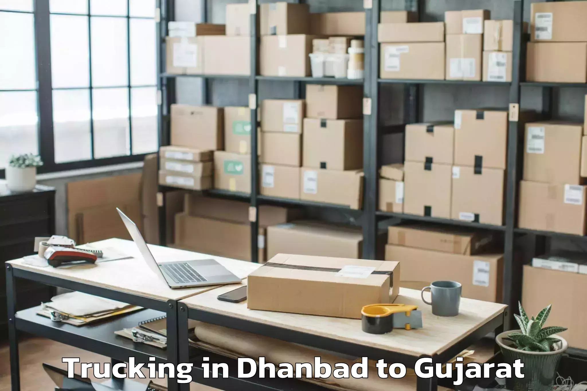 Book Dhanbad to Nadiad Trucking